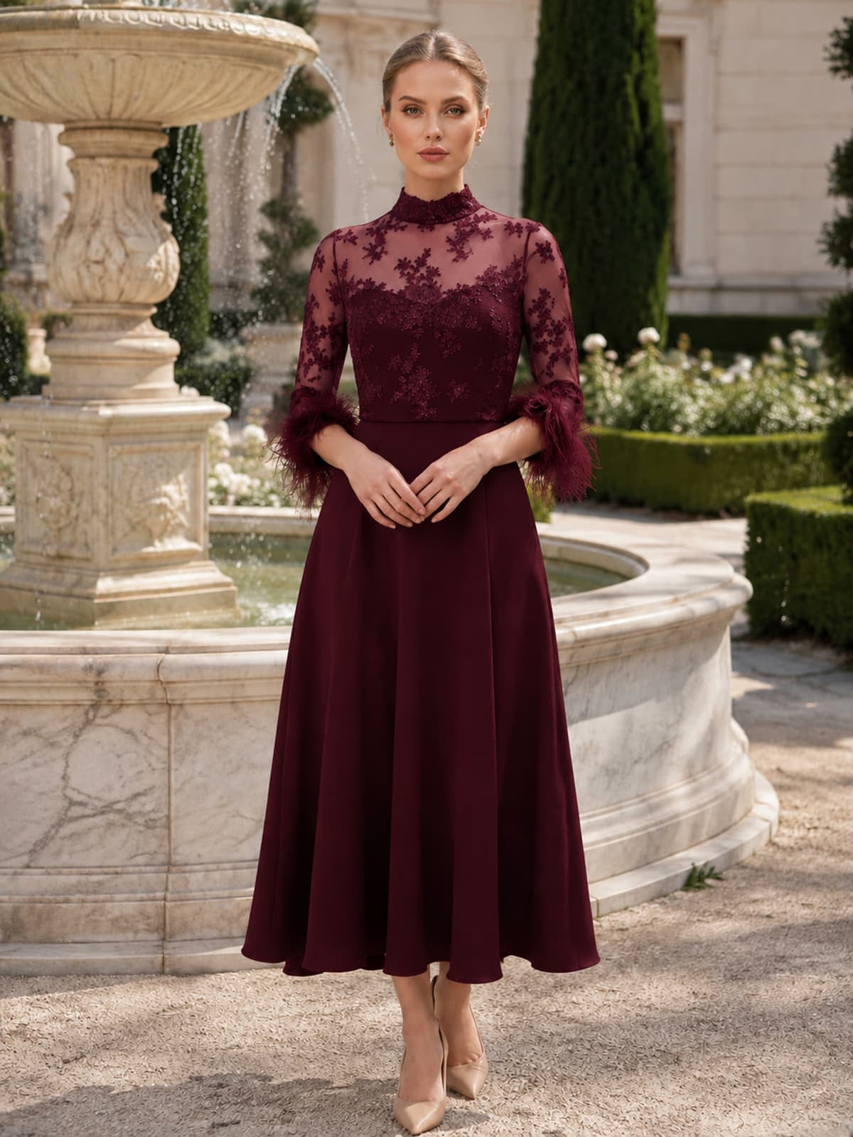 Burgundy chiffon mother of the bride dress front view with high neck lace bodice, sheer tulle sleeves, feather cuffs, sweetheart inner bodice, and tea length A-line skirt