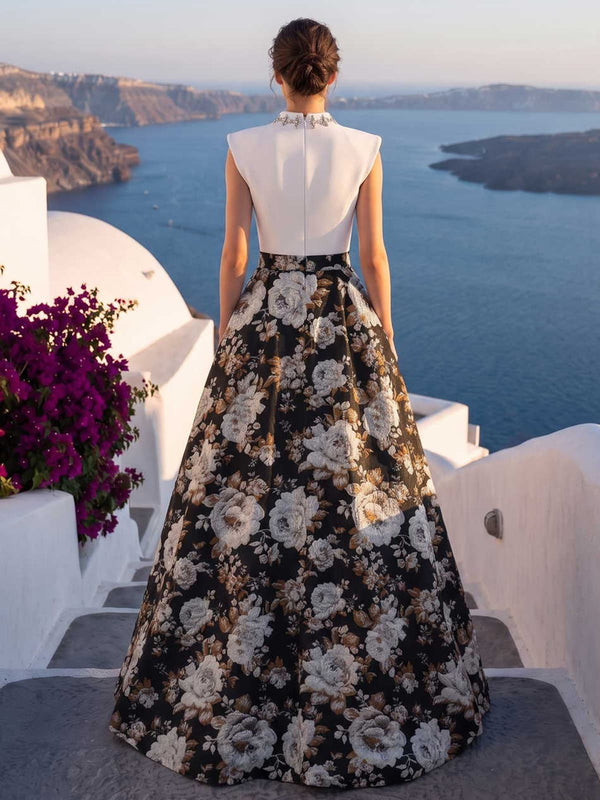 Jacquard satin mother of the bride dress back view with high neck collar, sleeveless structured bodice, concealed back zipper, black floral pattern, and floor length A-line skirt