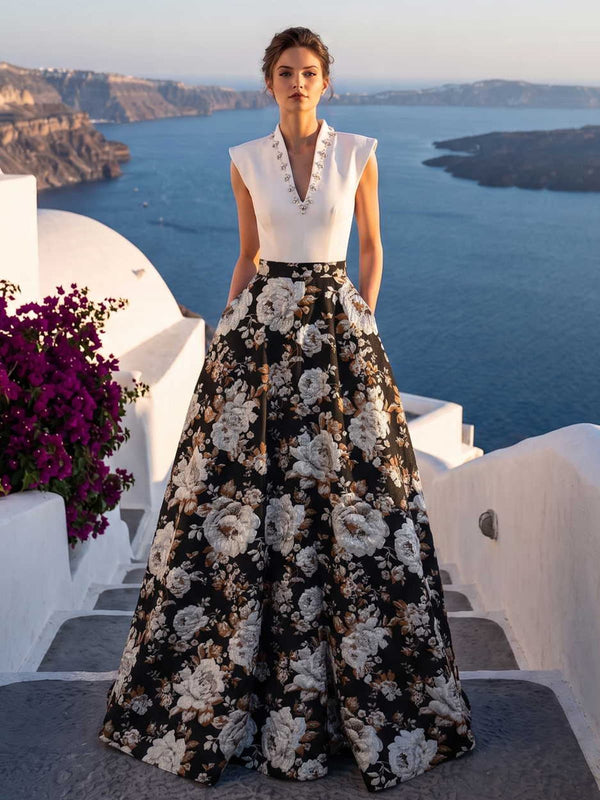 Jacquard satin mother of the bride dress front view with high neck, sleeveless structured bodice, black floral pattern, defined waist, and floor length A-line skirt