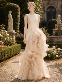 Champagne satin mother of the bride dress front view with sleeveless bateau neckline, fitted bodice, floor length skirt, and oversized organza 3D floral accents