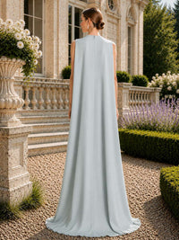 Ice blue satin mother of the bride dress back view with sleeveless cape-style back panel, center back zipper, flowing floor length satin train, and elegant formal silhouette