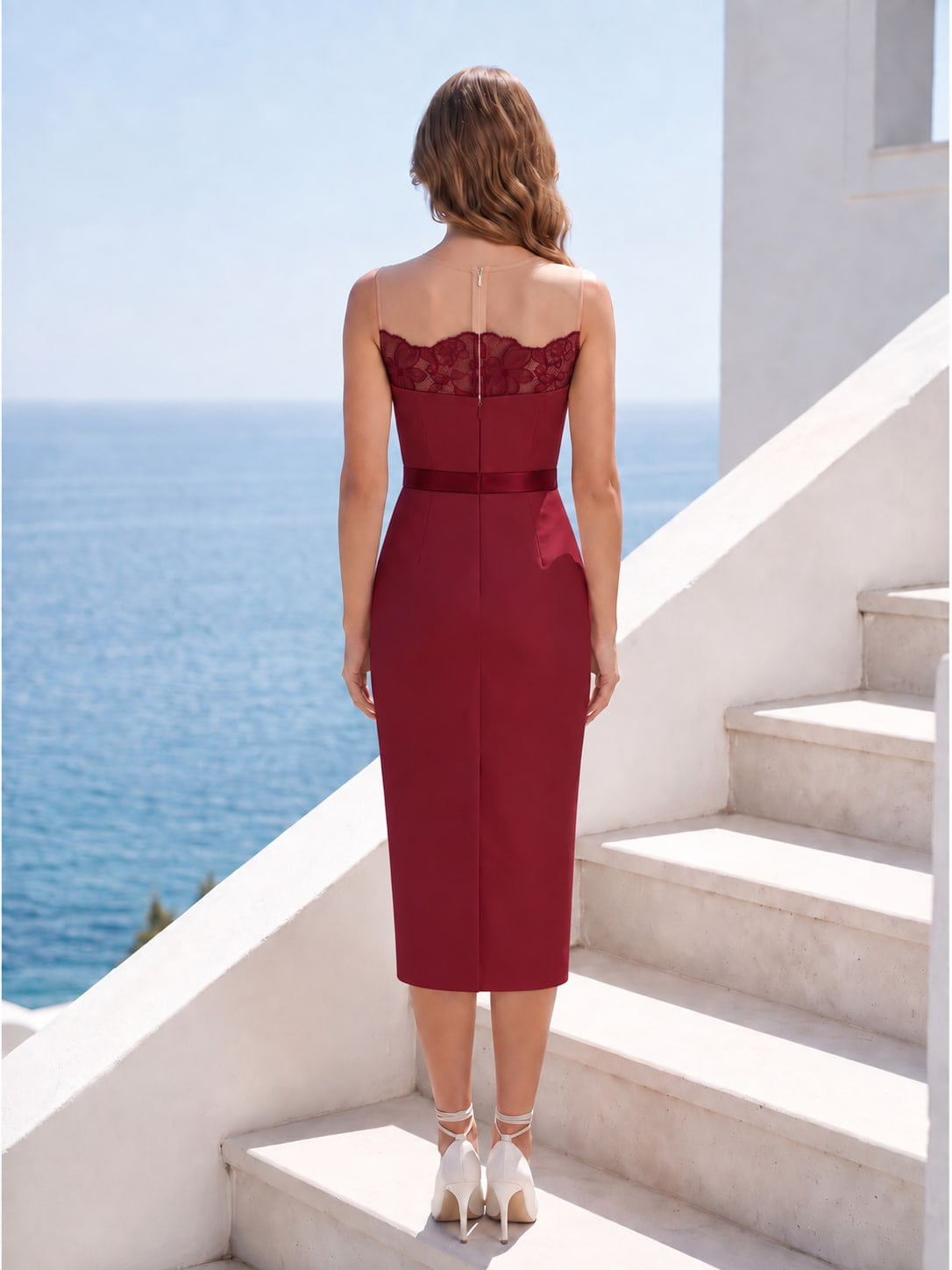 Back view of a burgundy imitation silk midi mother of the bride dress with sheer illusion upper back, floral lace panel, center-back zipper, fitted waist, and streamlined sheath skirt.