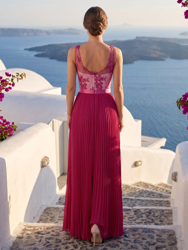 Back view of a floral lace and chiffon floor-length mother of the bride gown featuring a sheer illusion upper back, rounded scoop-back neckline, floral lace bodice, satin waistband, finely pleated chiffon skirt, and center-back zipper closure.