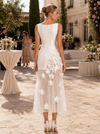 Back view of an As Pic Color satin and tulle midi mother of the bride dress with a bateau neckline, sleeveless design, concealed center-back zipper, cascading 3D floral appliqués, sheer tulle skirt, and sheath silhouette.