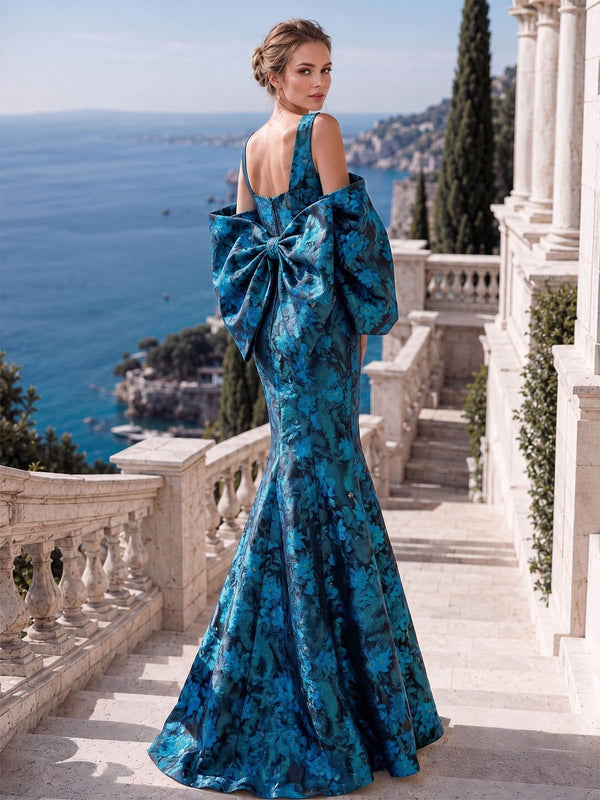 Back view of an As Pic Color floral jacquard satin floor-length mother of the bride dress featuring a low square back, concealed center-back zipper, dramatic oversized bow detail, puff sleeves, and flared mermaid hem.