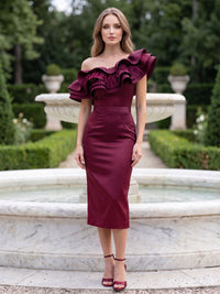 Front view of a burgundy satin knee-length mother of the bride dress with an off shoulder neckline, short ruffle sleeves, feather trim detail, fitted waist, and sheath silhouette.