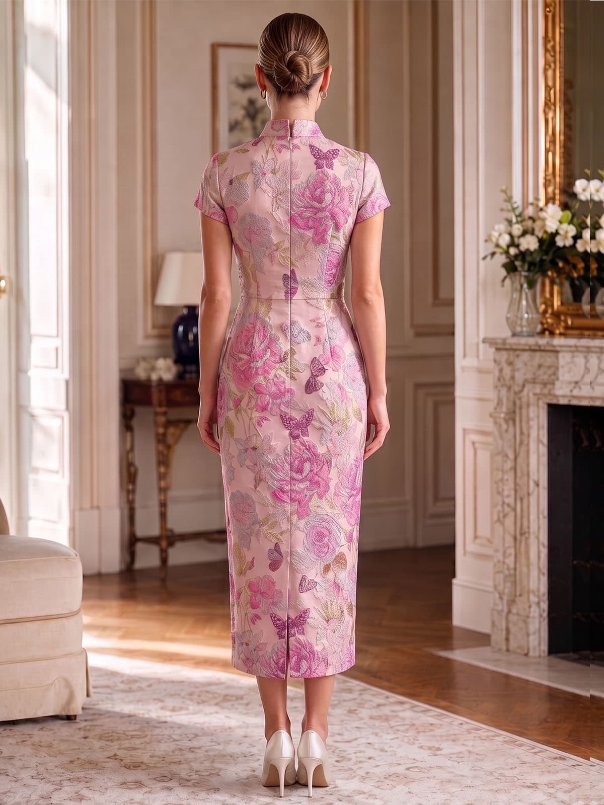 Back view of an as pic color floral jacquard satin tea length mother of the bride dress with concealed back zipper, short sleeves, mandarin collar, floral texture, and fitted sheath skirt.
