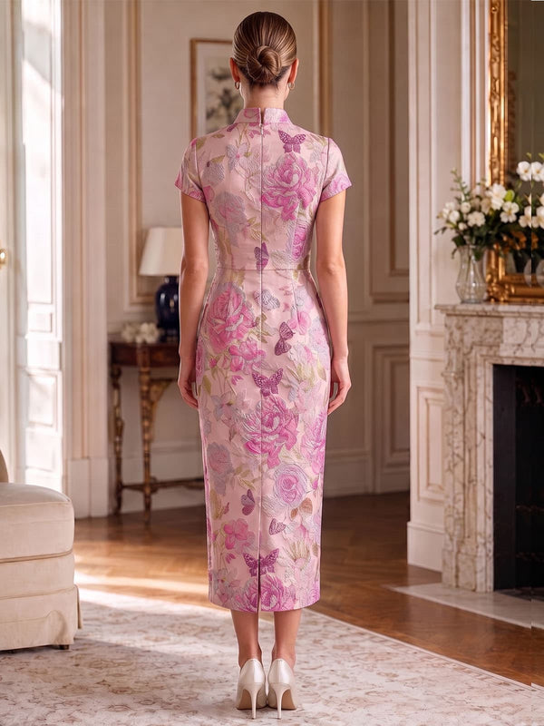 Back view of an as pic color floral jacquard satin tea length mother of the bride dress with concealed back zipper, short sleeves, mandarin collar, floral texture, and fitted sheath skirt.