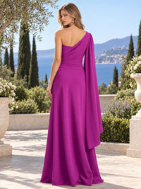Back view of a fuchsia chiffon mother of the bride dress with asymmetric one shoulder design, draped bodice, long cascading cape detail and floor length A-line skirt.