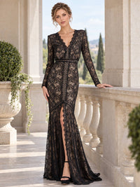 Front view of a floral lace mother of the bride dress featuring a V-neckline, long lace sleeves, contrast nude lining, defined waist, fitted mermaid silhouette and elegant front slit.