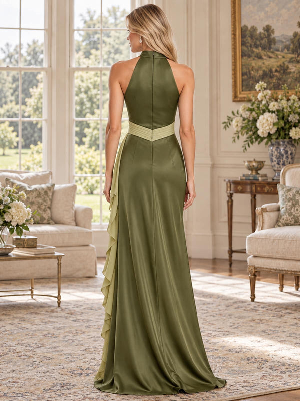 Back view of an olive green faux silk mother of the bride dress featuring a high halter back, concealed center-back zipper, contrast light sage waistband, cascading side ruffle and floor-length silhouette.