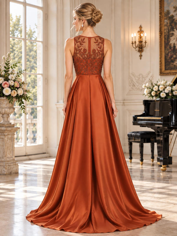 Back view of an elegant faux silk mother of the bride dress featuring a sheer floral lace and beaded back bodice, concealed center-back zipper, defined waist and full floor-length A-line skirt.