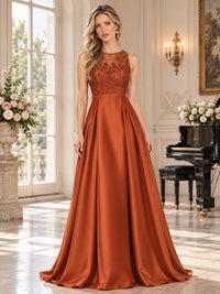 Front view of an elegant faux silk mother of the bride dress featuring a sleeveless illusion round neckline, floral lace and beaded bodice, defined natural waist, structured pleats and a flowing floor-length A-line skirt.