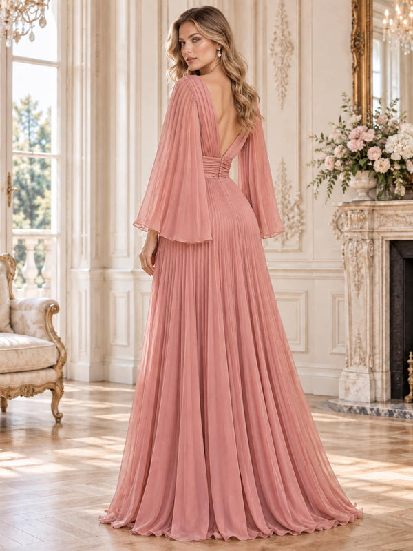 Back view of an elegant pleated chiffon mother of the bride dress featuring a deep V-back, flowing cape sleeves, fitted pleated waistband and a full floor-length pleated A-line skirt.