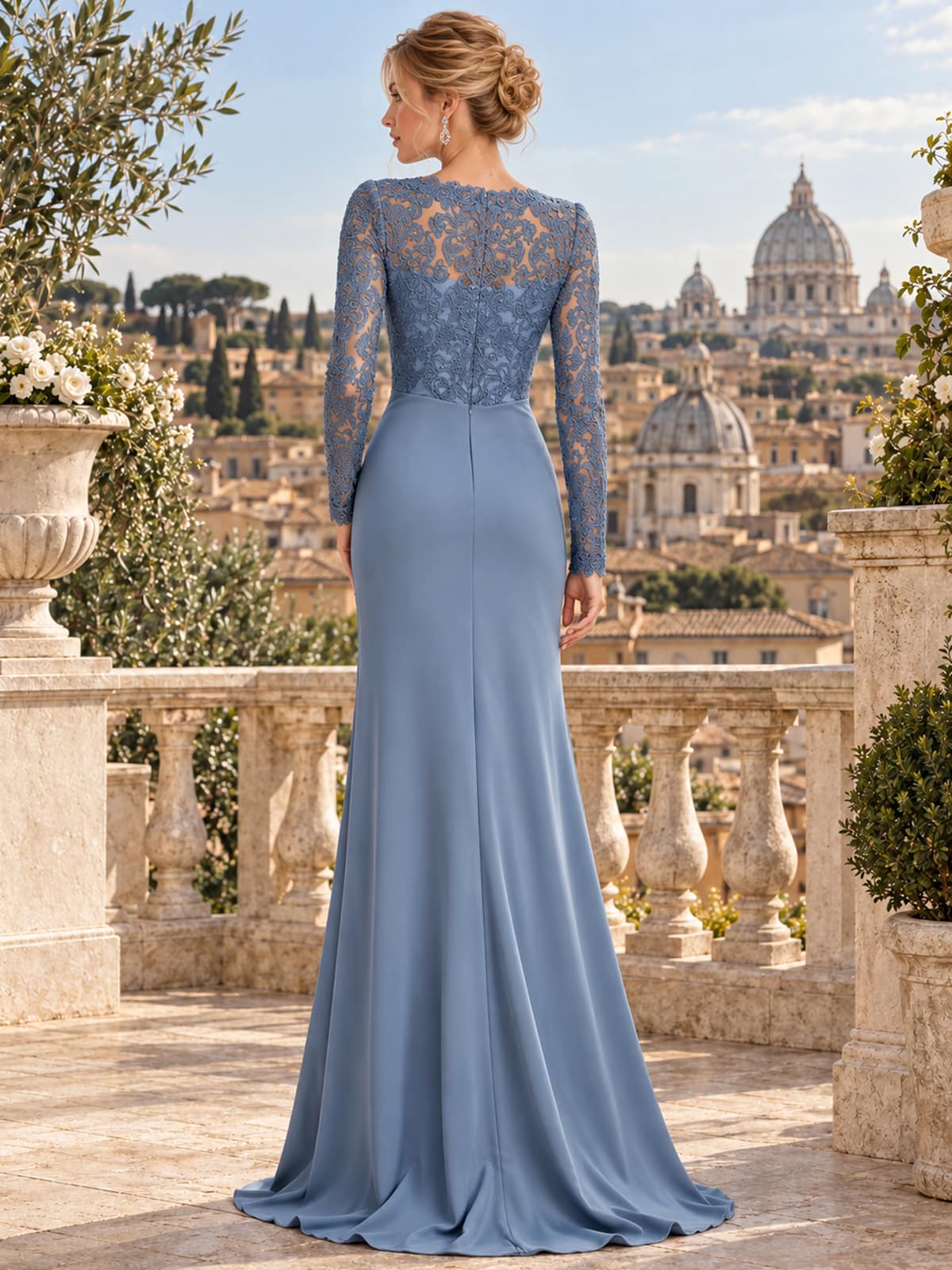 Back view of an elegant lace and satin mother of the bride dress featuring a sheer floral lace upper back and long sleeves, fitted lace bodice, concealed center-back zipper and a smooth floor-length satin skirt.