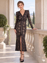 Front view of an elegant floral lace mother of the bride dress featuring a V-neckline with scalloped lace trim, sheer long lace sleeves, defined waist, fitted mermaid silhouette, decorative lace paneling, front slit and softly flared midi hem.