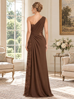 Back view of an elegant chiffon and floral lace mother of the bride dress featuring an asymmetrical one-shoulder design, diagonal pleated chiffon draping, floral lace side paneling, fitted waist and flowing floor-length skirt.