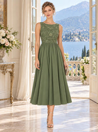 Front view of an elegant sage green chiffon mother of the bride dress featuring a bateau neckline, sleeveless floral beaded bodice, dimensional floral embellishments, defined natural waist and softly gathered tea-length A-line chiffon skirt.
