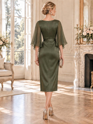 Back view of an elegant olive green faux silk mother of the bride dress featuring a high back, sheer chiffon flutter sleeves, defined waistband, concealed center-back zipper and a clean tea-length sheath skirt.