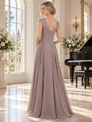 Back view of a taupe lace and chiffon mother of the bride dress featuring a floral lace bodice, elegant V-back neckline, cap sleeves, pleated chiffon waist, concealed center-back zipper and flowing floor-length A-line skirt.