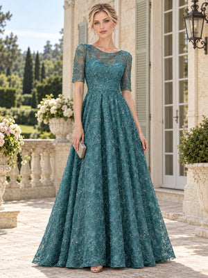 Front view of a teal floral lace mother of the bride dress featuring a bateau neckline, sheer floral lace upper bodice, elbow-length lace sleeves, fitted natural waist and full floor-length A-line skirt with allover floral lace.