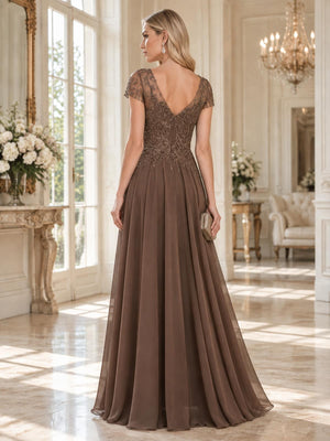 Back view of a floor-length lace and chiffon mother of the bride dress featuring an elegant V-back, sheer embroidered lace cap sleeves, embellished floral bodice, concealed center-back zipper and flowing A-line chiffon skirt.