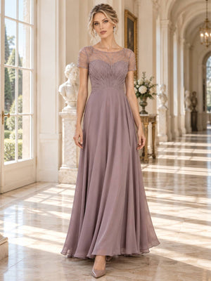 Front view of a floor-length mother of the bride dress featuring an intricately beaded and embroidered lace bodice, sheer illusion bateau neckline, short sleeves, defined natural waist and flowing A-line chiffon skirt.