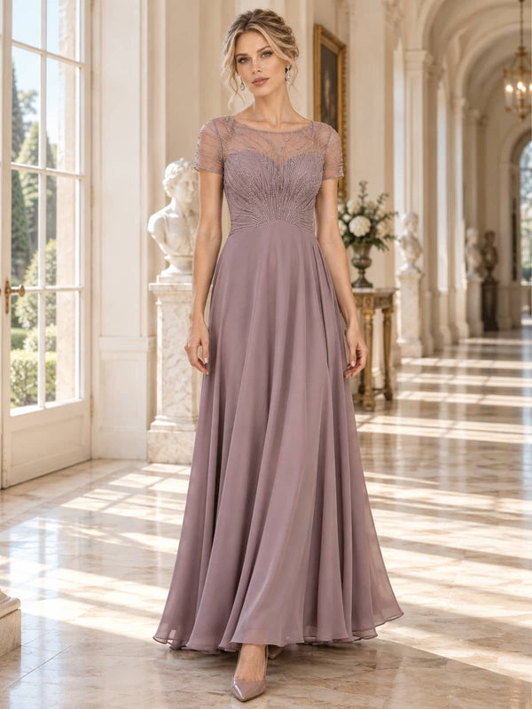 Front view of a floor-length mother of the bride dress featuring an intricately beaded and embroidered lace bodice, sheer illusion bateau neckline, short sleeves, defined natural waist and flowing A-line chiffon skirt.