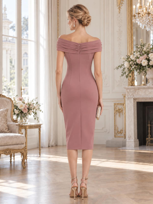 Back view of a dusty rose chiffon mother of the bride dress featuring a softly ruched off-the-shoulder neckline, fitted sheath silhouette, clean tea-length skirt and concealed center-back zipper.