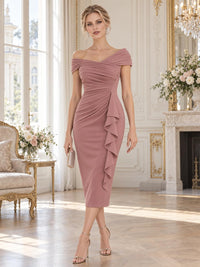 Front view of a dusty rose chiffon mother of the bride dress featuring an off-the-shoulder crossover neckline, diagonal ruched bodice, fitted sheath silhouette, cascading side ruffle and elegant tea-length hem.