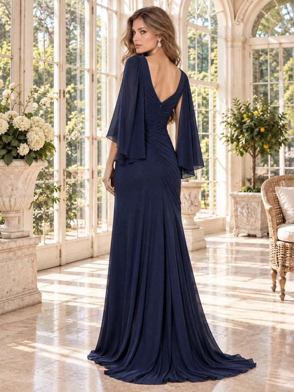 Back view of a navy blue chiffon mother of the bride dress featuring a V-shaped back neckline, flowing cape sleeves, gathered center-back detailing and an elegant floor-length sheath skirt.