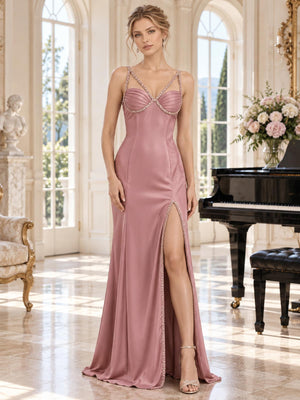 Front view of a dusty rose satin mother of the bride dress featuring a sweetheart neckline, pleated bust, beaded double straps, fitted sheath silhouette and a beaded high front slit.