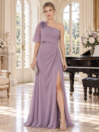 Front view of a dusty lavender chiffon mother of the bride dress featuring an asymmetric one-shoulder neckline, dimensional flower appliqué, flowing chiffon cape, softly draped waist, front slit and floor-length A-line skirt.