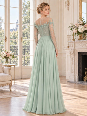 Back view of a sage green lace and chiffon mother of the bride dress featuring a sheer illusion back, long embellished lace sleeves, dimensional floral appliqués, delicate beadwork and a flowing floor-length A-line chiffon skirt.