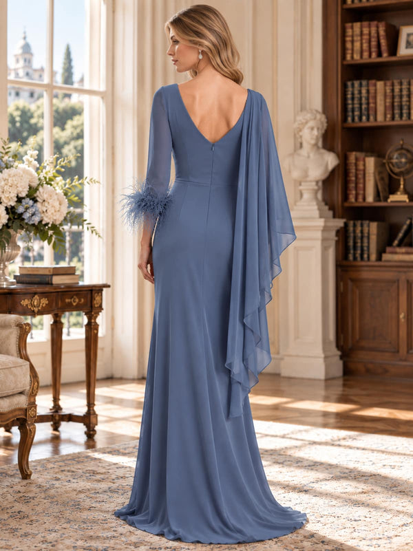 Back view of a dusty blue chiffon mother of the bride dress featuring a V-back, flowing asymmetric cape sleeve, feather-trim cuff, fitted waist and an elegant floor-length sheath silhouette.