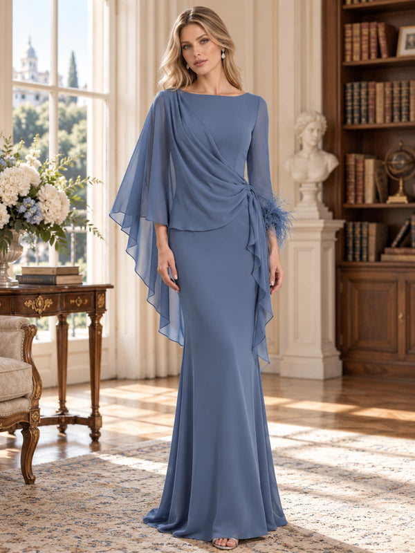 Front view of a dusty blue chiffon mother of the bride dress featuring a bateau neckline, asymmetric draped bodice, flowing cape sleeves, feather cuff detail, gathered side waist and a floor-length sheath silhouette.