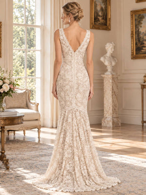 Back view of an ivory floral lace mother of the bride evening dress featuring a deep V-back, sleeveless fitted bodice, defined lace waist, fitted hips and softly flared floor-length mermaid skirt.