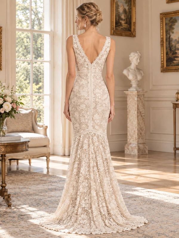 Back view of an ivory floral lace mother of the bride evening dress featuring a deep V-back, sleeveless fitted bodice, defined lace waist, fitted hips and softly flared floor-length mermaid skirt.