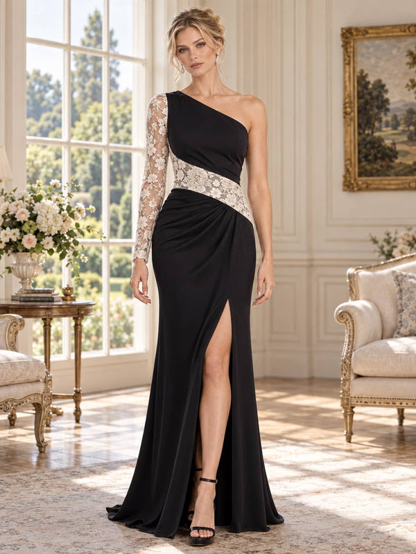 Front view of a black and ivory lace satin mother of the bride evening dress featuring an asymmetric one-shoulder neckline, single sheer floral lace long sleeve, diagonal contrast lace waist panel, draped fitted skirt and high front slit.