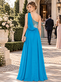 Chiffon A-line mother of the bride dress with draped one-shoulder detail, lace waist applique and floor-length skirt, back view.