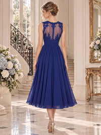 Floral lace chiffon A-line midi mother of the bride dress with sheer illusion back and center-back closure, back view.
