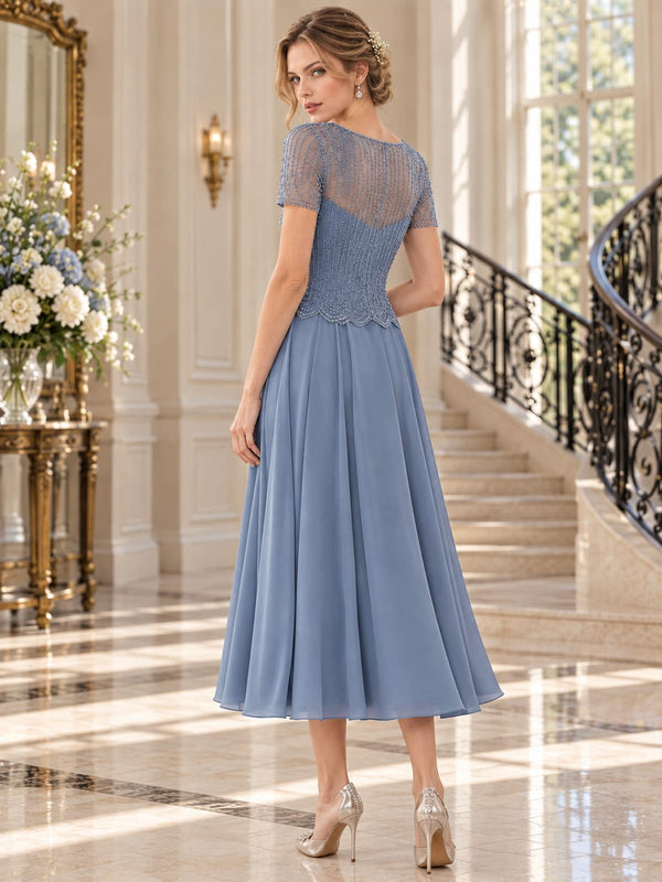 Floral beaded lace A-line midi mother of the bride dress with sheer illusion back and center-back closure, back view.