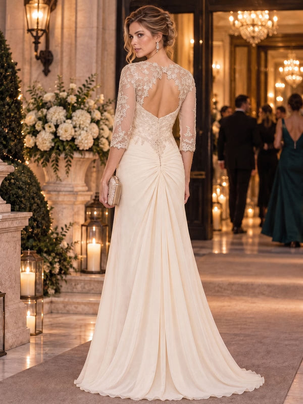 Floral lace chiffon floor-length mother of the bride dress with illusion lace back, three-quarter sleeves and center-back closure, back view.