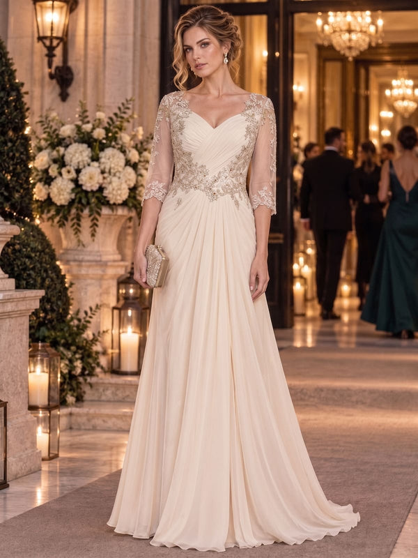 Floral lace chiffon A-line floor-length mother of the bride dress with illusion neckline, three-quarter sleeves and draped skirt, front view.