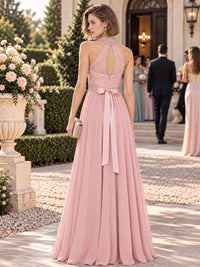 Floral lace chiffon mother of the bride dress with keyhole back, bow sash and flowing floor-length A-line skirt, back view.