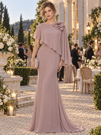 Chiffon column floor-length mother of the bride evening dress with boat neckline, draped cape and floral shoulder detail, front view.