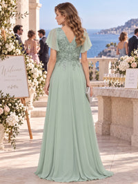 Sequin floral lace chiffon mother of the bride dress with V-back, embellished bodice and flowing floor-length A-line skirt, back view.
