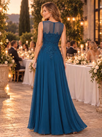 Back view of a chiffon A-line mother of the bride evening dress with illusion back, lace appliqué detailing, and floor-length skirt.