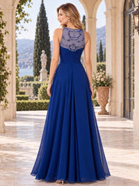 Back view of a beaded lace chiffon A-line mother of the bride dress with embellished illusion back and floor-length skirt.