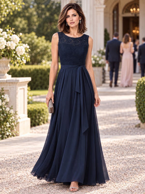 Front view of a lace chiffon A-line mother of the bride dress with jewel neckline, side sash and floor-length skirt.